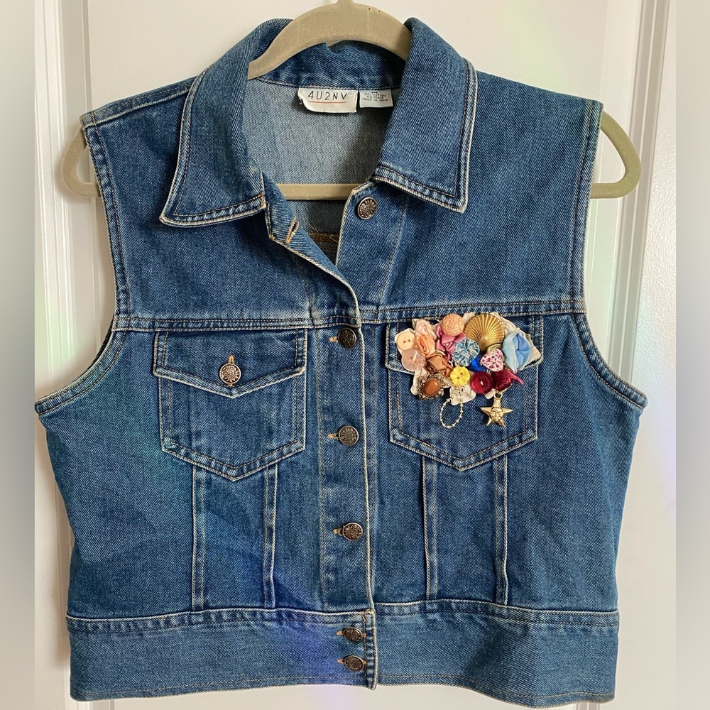 Medium 100% cotton denim vest with hand-sewn embellishments
